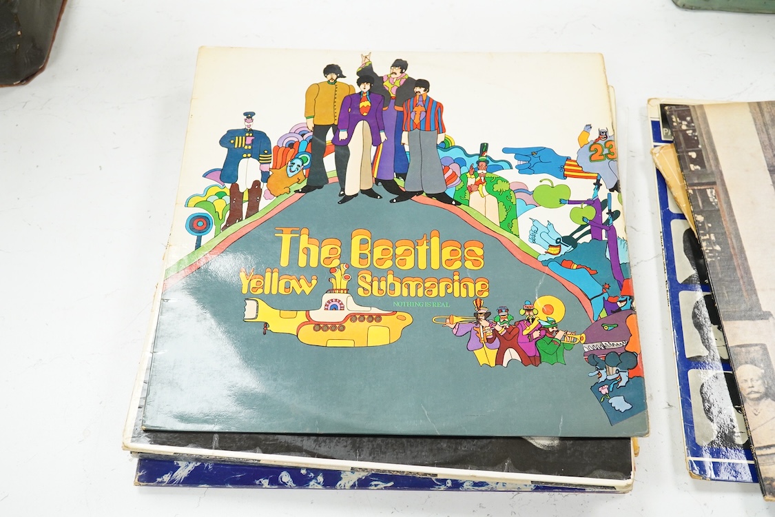 Eleven LP record albums including nine The Beatles and related albums; Beatles For Sale, Hey Jude, Yellow Submarine, All Things Must Pass, etc., together with the Rolling Stones; Their Satanic Majesties Request, and Pink